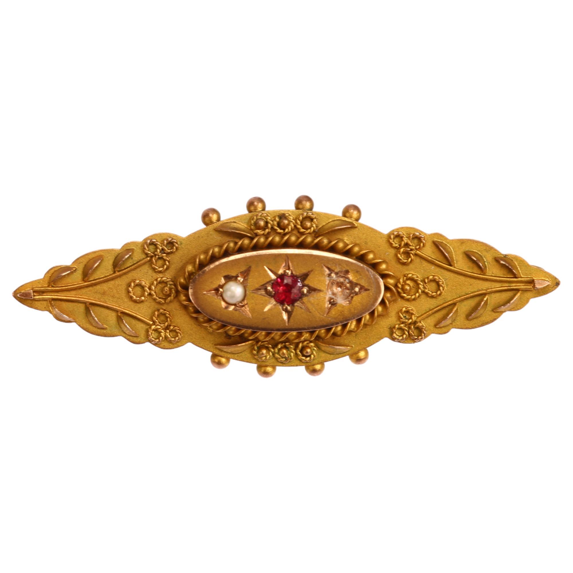 A Victorian 9ct gold garnet and pearl memorial brooch, maker M&G, length 40.7mm, 3.2g No damage or