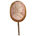 A Victorian pink coral cameo stickpin, circa 1860, relief carved depicting male profile, in unmarked