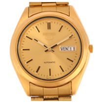 SEIKO 5 - a gold plated stainless steel automatic calendar bracelet watch, ref. 7S26-0440, champagne