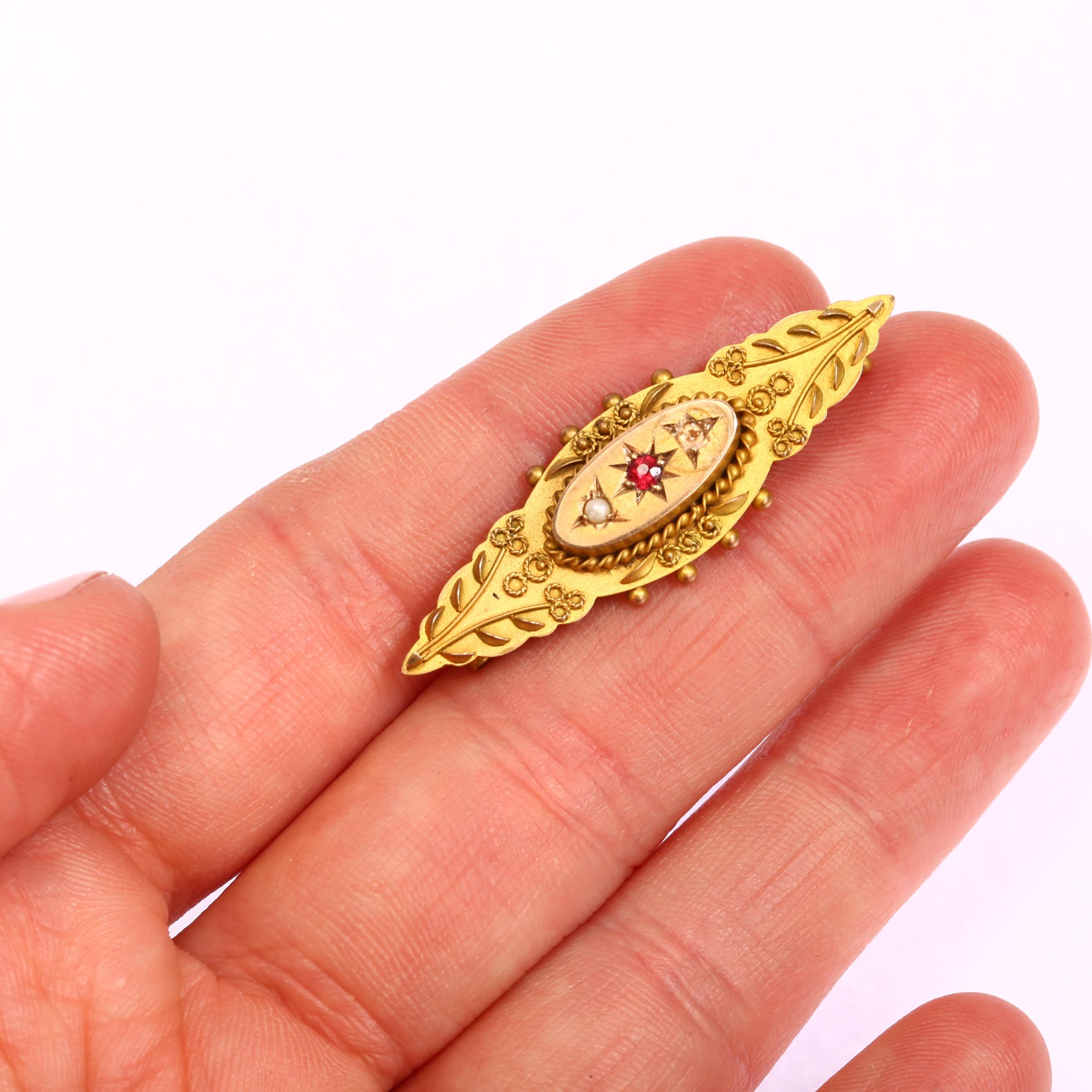 A Victorian 9ct gold garnet and pearl memorial brooch, maker M&G, length 40.7mm, 3.2g No damage or - Image 3 of 3