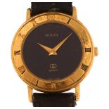 GUCCI - a lady's gold plated 3001L quartz wristwatch, circa 1986, black dial with Roman numeral