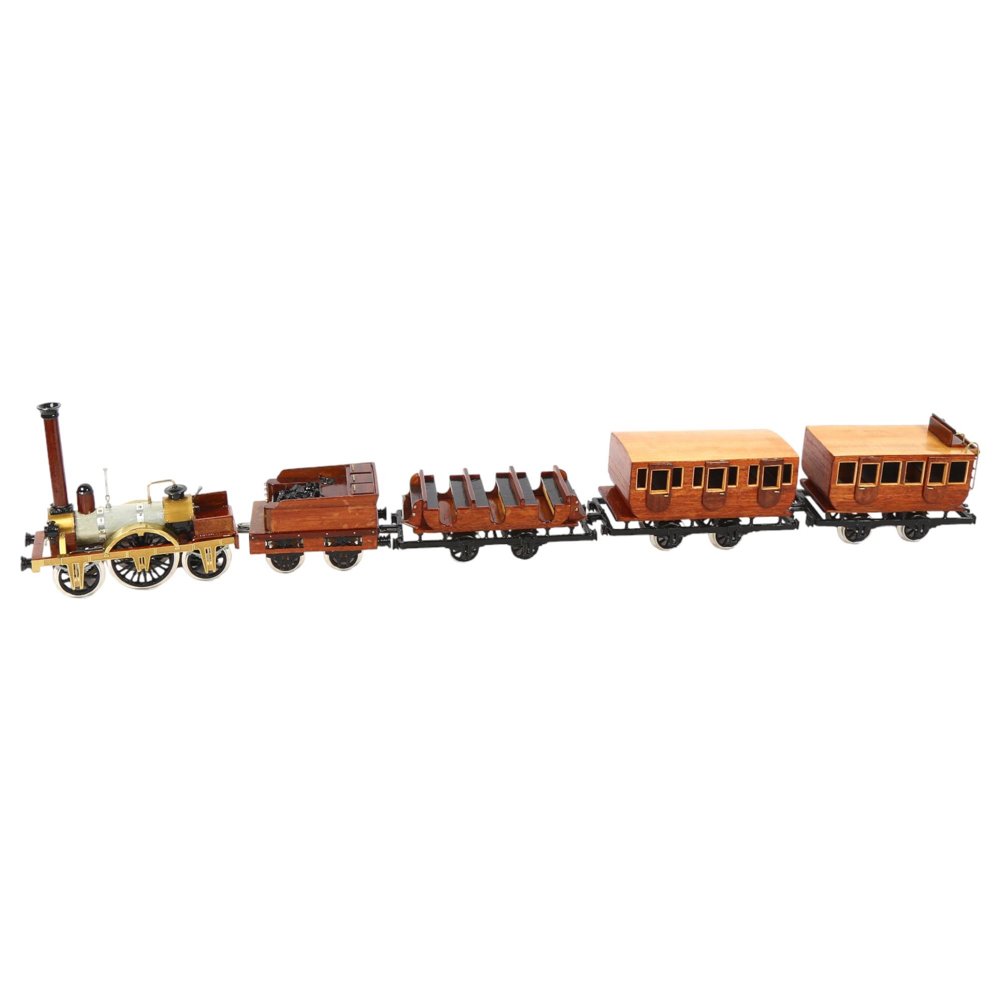 A handmade wooden model of the Adler locomotive, with tender and passenger carriages, overall length
