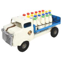A Vintage Tri-ang milk lorry, with associated milk bottles, 4 of the 28 milk bottles are missing