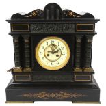 A Victorian architectural black slate and gilded mantel clock, 8-day movement striking in a gong,