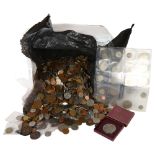 A large quantity of pre-decimal UK and worldwide coins, and 2 sleeves of English silver coins etc