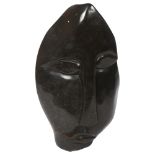 S Cavara, a carved soapstone abstract face study, H34cm