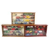 A quantity of loose Lledo diecast vehicles, the Days Gone Series, in associated wooden display cases