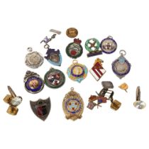 A collection of 8 silver and enamel sporting fobs, including the Aldershot Football Association,