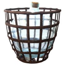 A large green glass carboy in a pressed metal lattice surround, bottle height 52cm, overall height