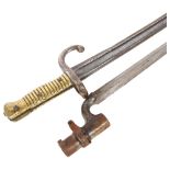 A 19th century French bayonet, serial no. 50130 (worn), overall length 69cm, together with an