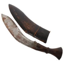 A kukri knife with leather scabbard, blade length 34cm Knife is in good overall condition,