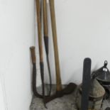 Four various vintage tools including a sickle by Swift.