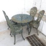 A painted cast iron garden table, 80x66cm, and a similar set of four chairs.