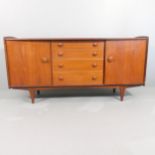 YOUNGER FURNITURE - A mid-century teak sideboard, with four drawers between two cupboard doors and