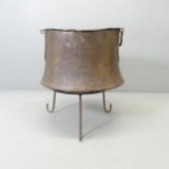 An antique copper copper on stand, 57x66cm.