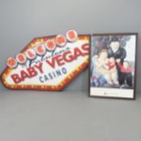 A "Baby Vegas" sign, 200x110cm, and a museum poster for Museo Botero (2).