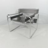 A Marcel Breuer Wassily style chair in black leather and chrome.