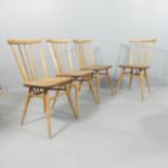 A mid-century Ercol set of four model 391 stick back dining chairs, with elm seats and maker's