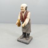 A painted composite shop advertising figure. Height 65cm.