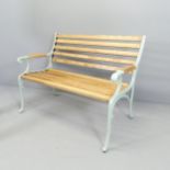 A modern pine slatted garden bench with cast iron ends. 105x84x60cm.