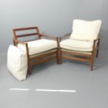 A pair of mid-century lounge chairs in the manner of Cintique, with teak frames, sprung seat and