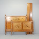A French pitch pine 4' double bed, with inlaid foliate decoration. Generally good used condition.
