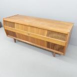 A mid-century teak cased HMV Solid State Stereogram, with Garrard 2025TC turntable. 143x62x52cm.