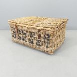 A vintage wicker laundry basket, named Dawn & Dorset. 67x32x55cm.