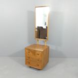 A mid-century Ercol elm model 410 cheval chest of three drawers with portrait mirror. Overall