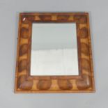 An 18th century style rectangular walnut cushion framed wall mirror. 67x76cm.