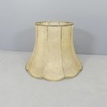 A vintage hide lampshade. 60x44cm (top diameter 36cm).
