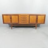 G-PLAN - a mid-century teak Fresco sideboard, by Victor Wilkins with four drawers between paired