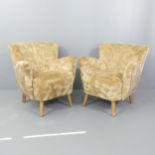 A pair of Art Deco shell back cocktail armchairs.