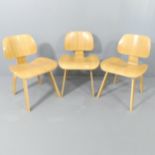 A set of three bent ply side chairs in the manner of Charles Eames. Some chips, marks and scratches.