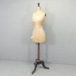A vintage dressmaker's mannequin, indistinctly labelled. Height 165cm.