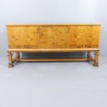 A 1920s Swedish Grace Art Deco sideboard cabinet on stand in flame birch with Neoclassical marquetry