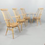 A set of four mid-century Ercol Goldsmith elm and beech stick-back dining chairs