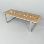 DE NISCO - A mid-century Egyptian Revival ceramic and chrome rectangular coffee table, circa