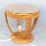 A maple Art Deco circular side table, with bevelled glass top and brass label to base "