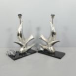 A pair of contemporary dolphin design design table lamps attributed to Heathfield Lighting. Height