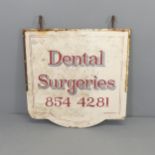 A vintage painted wooden sign "Dental Surgeries". 77x86cm.