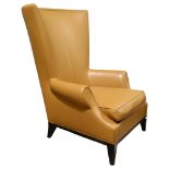 Donghia, a contemporary design Egret leather wing lounge chair with maker’s label under cushion,