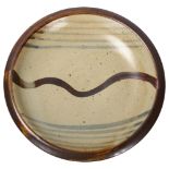 St Ives/Leach studio pottery, a stoneware "Wave" plate, pottery mark to base, diameter 23cm