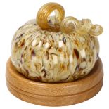 A Murano hand made glass pumpkin on later turned oak base, diameter 17cm Good condition, no chips or