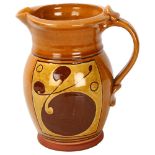 Attributed Norah Braden (1901-2001), an earthenware jug with slip decoration, makers mark to base,