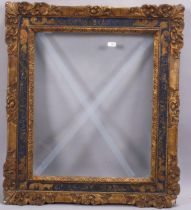 An early 20th century gilt-gesso picture frame with blue and gilt frieze, inside dimensions 46cm x