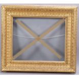 A 19th century gilt-gesso picture frame, inside measurements 39cm x 46cm Good condition, a few