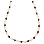 A modern 9ct gold cultured pearl and onyx bead necklace, 40cm, 10.6g No damage or repair, all stones