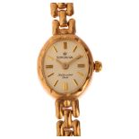 SOVEREIGN - a lady's 9ct gold quartz bracelet watch, silvered dial with applied gilt baton hour