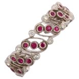 LUKE STOCKLEY - an 18ct white gold ruby and diamond full eternity ring, in Art Deco style, pierced